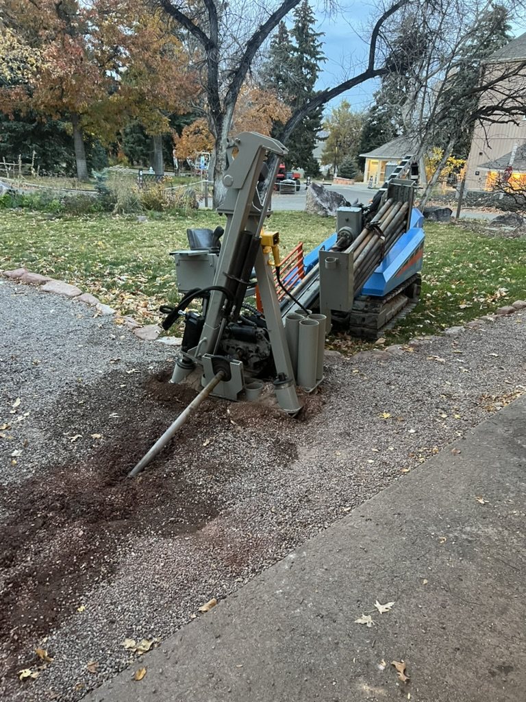 Compact boring rig set up on a residential property